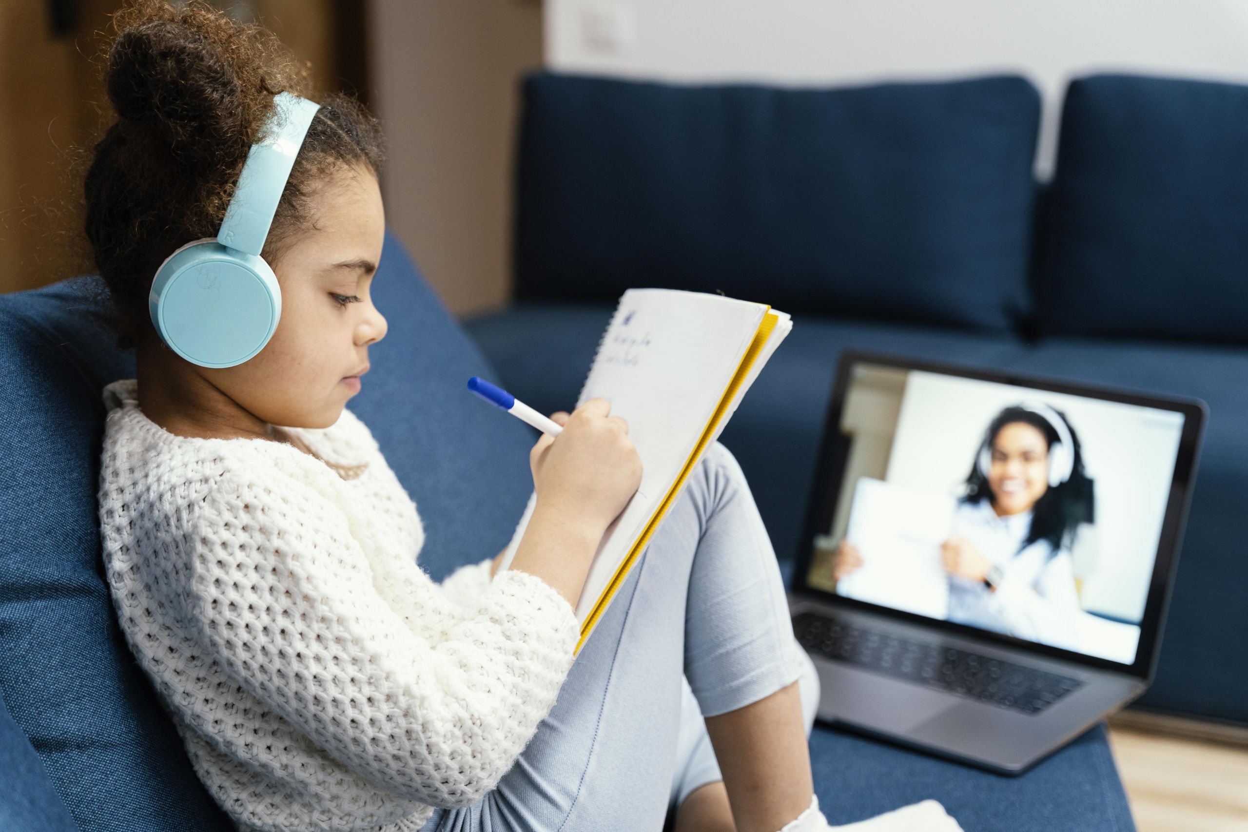 side-view-little-girl-online-school-with-laptop-headphones-1 image Eagle Online Learning Academy