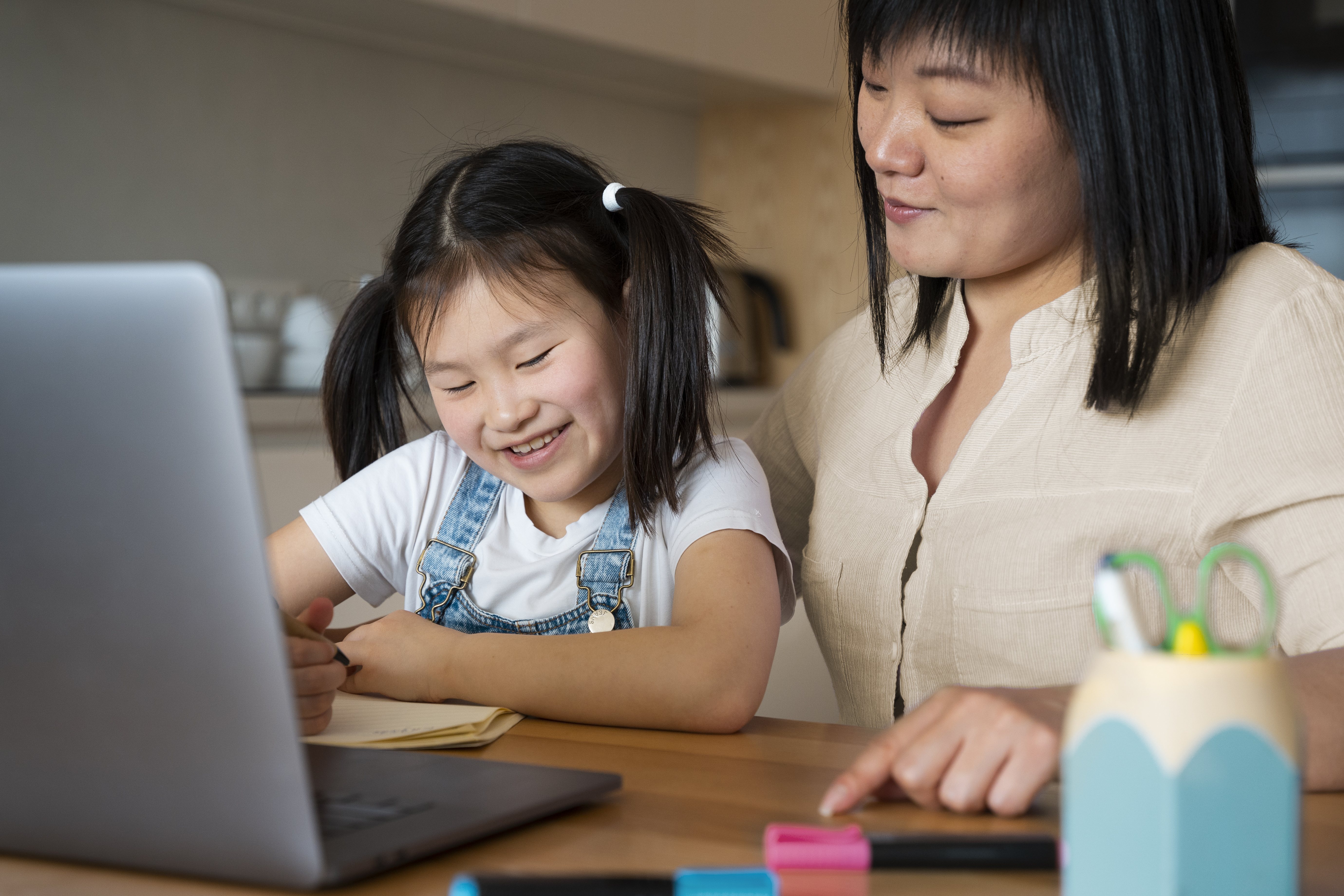 close-up-mother-kid-desk image